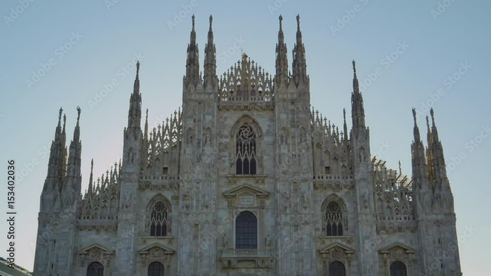 Milan,01/01/2017: cathedral basilica tilt down at sunrise Milan,01/01/2017: cathedral basilica tilt down at sunrise