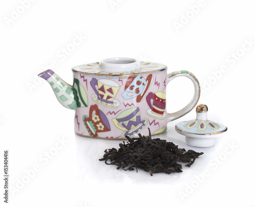 Teapot for brewing and black tea on white background. Isolated