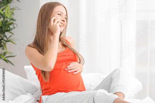 Emotional pregnant woman ta...