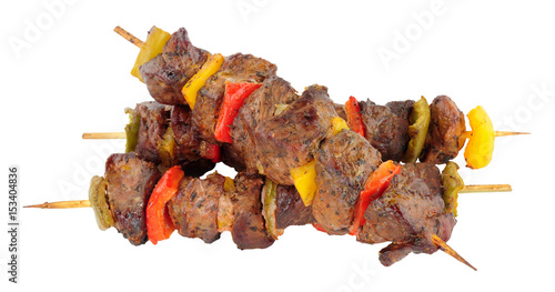 Tableau sur toile Grilled lamb meat and sweet pepper kebabs isolated on a white background