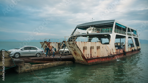 Картината върху платно An old rusty ferry docking into port