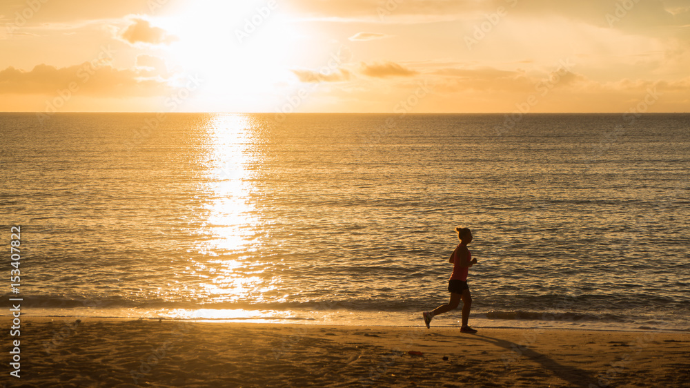 Running on the beach with sunrise