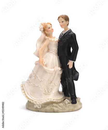 Bride and groom, old cake topper on white background