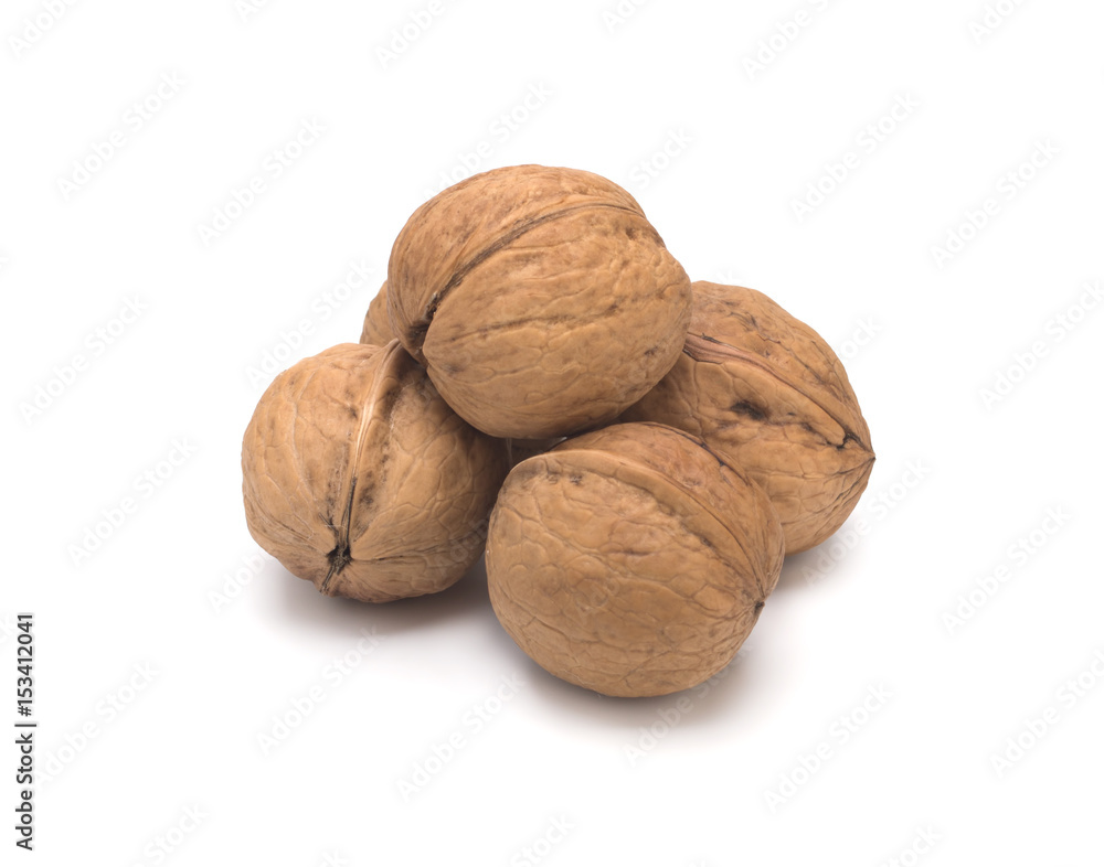 Walnuts in shell on a white background. Walnuts in shell on a white background.