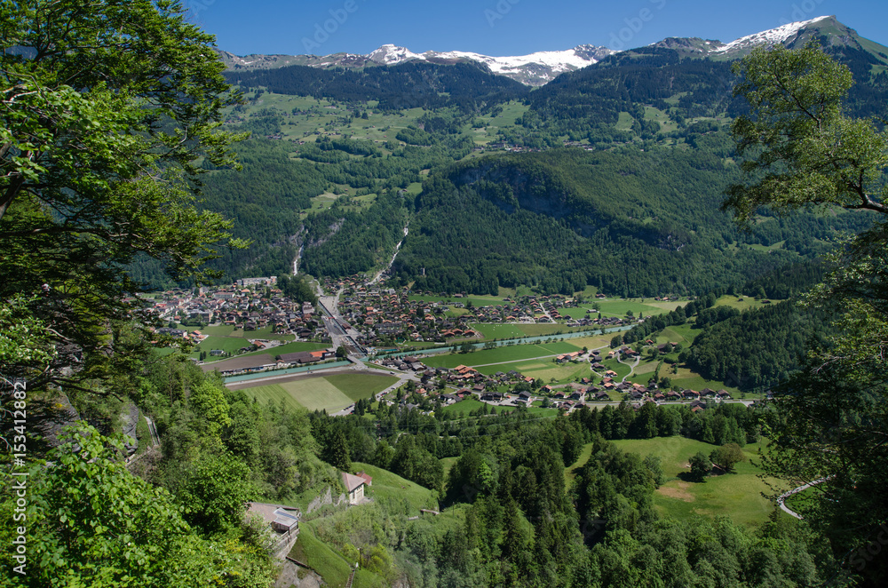 Swiss village in valley near Reichenbach falls (Reichenbachfall) at Swiss Alps, Switzerland