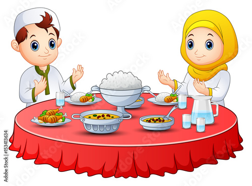 muslim kid pray together before break fasting