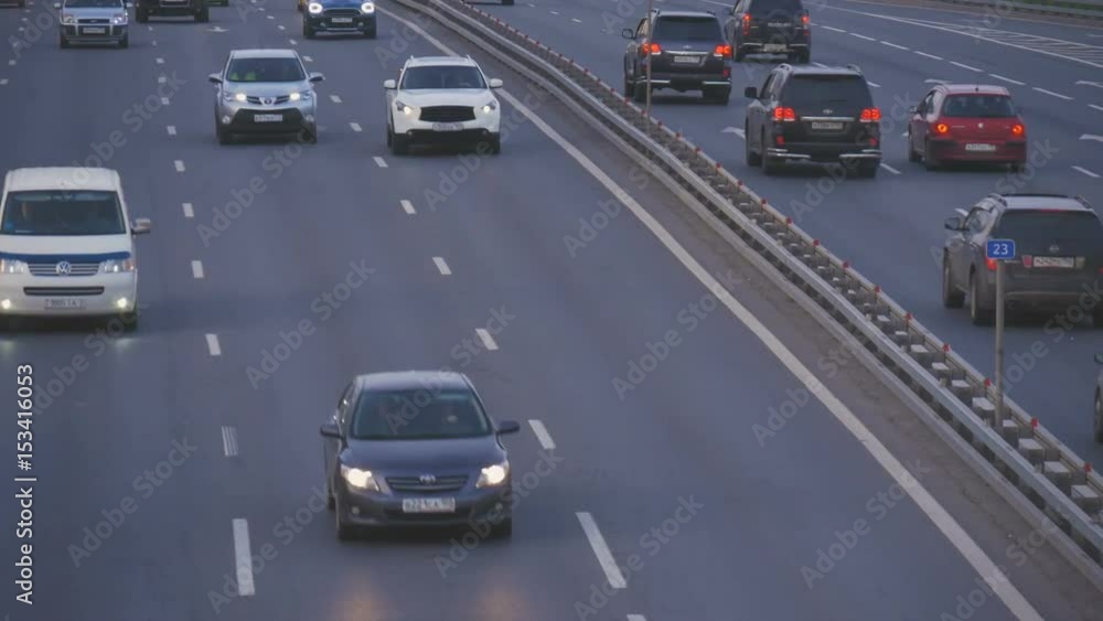 Timelapse. Very intense traffic on the streets of the city. In evening time. One road passes under the other. Timelapse. Very intense traffic on the streets of the city. In evening time. One road passes under the other.