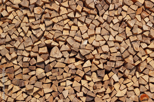 Stack of chopped firewoods background