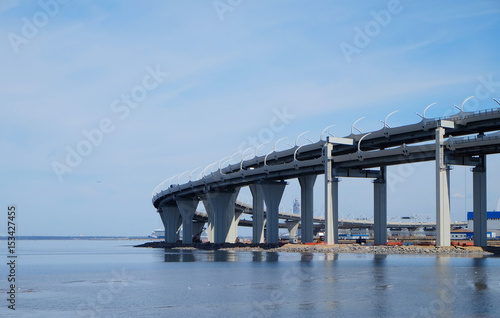 curved viaduct with the highway above the sea surface © sergeevspb