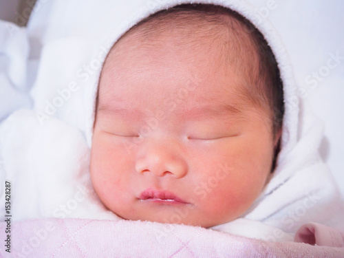 Cute newborn asian baby girl