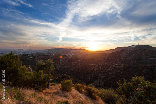 Fotografiet Los Angeles, view from Griffith Park at the Hollywood hills at sunset, southern