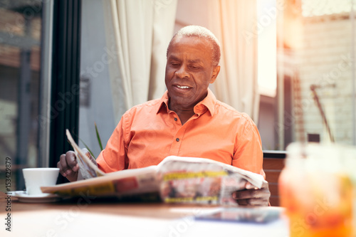 Businessman reading newspaper