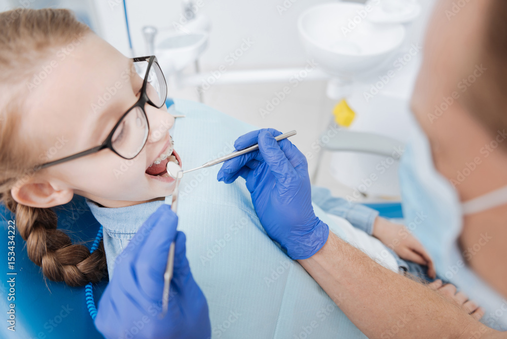 Admirable young lady visiting her dentist Admirable young lady visiting her dentist