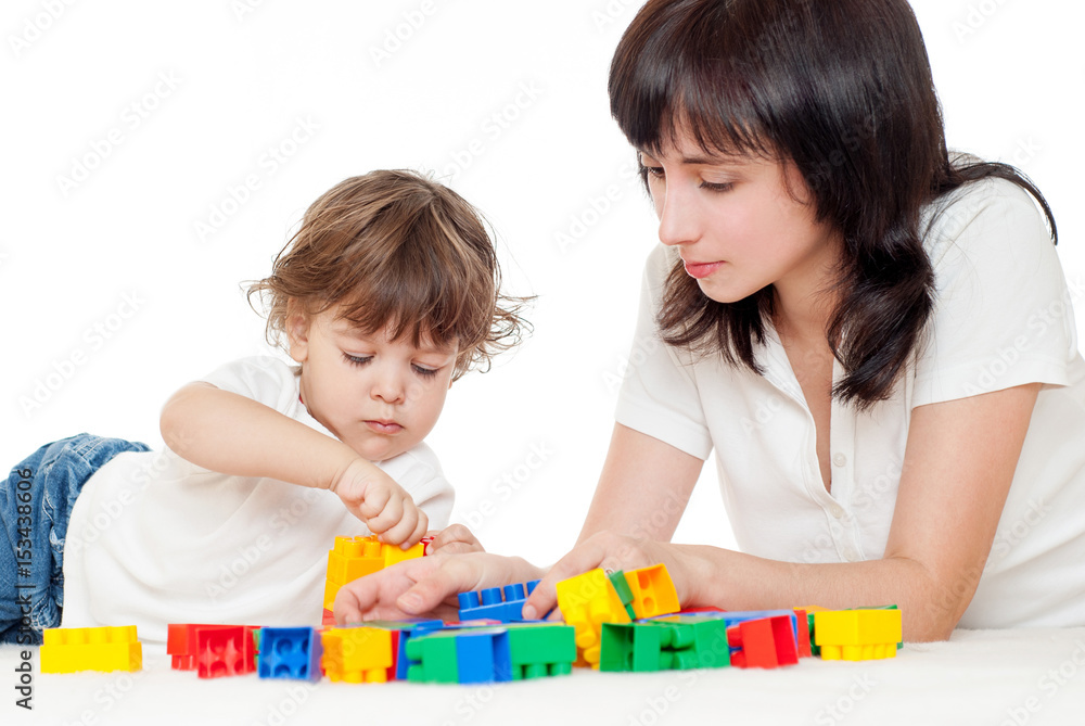 Mother and baby playing and smiling. Happy family. Mother and baby playing and smiling. Happy family.
