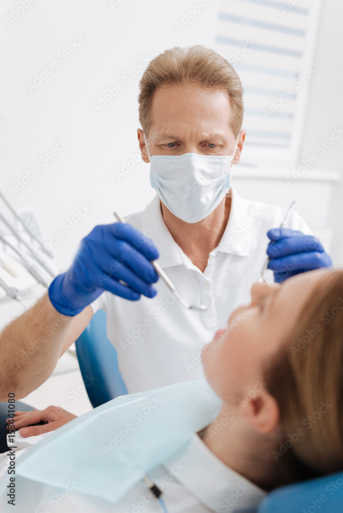 Successful local expert performing a general checkup Successful local expert performing a general checkup