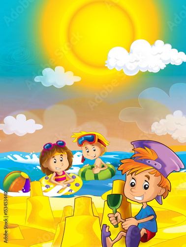 children playing at the beach having fun by the sea or ocean