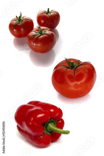 Tomatoes and peppers isolated on white background
