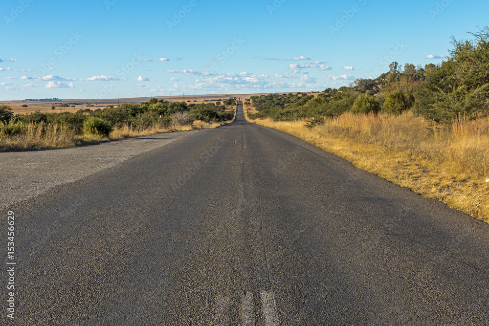 Empty Rural Asphalt Road Running Through Dry Winter Landscape