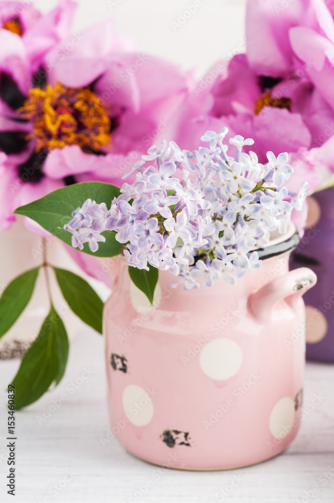 Closeup peonies and lilac flowers