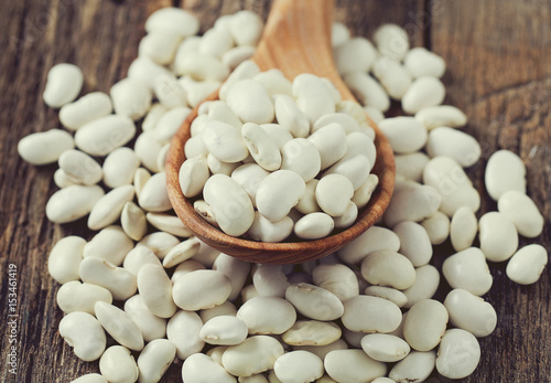 white butter beans on wooden surface