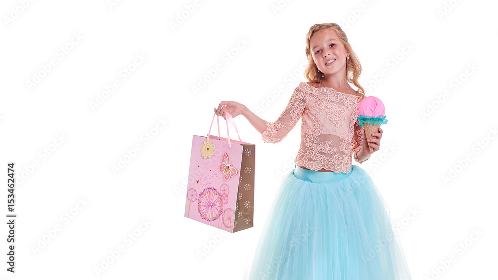 Cheerful girl in beautiful clothes posing in studio. Life style. Joy. Colored clothes Cheerful girl in beautiful clothes posing in studio. Life style. Joy. Colored clothes