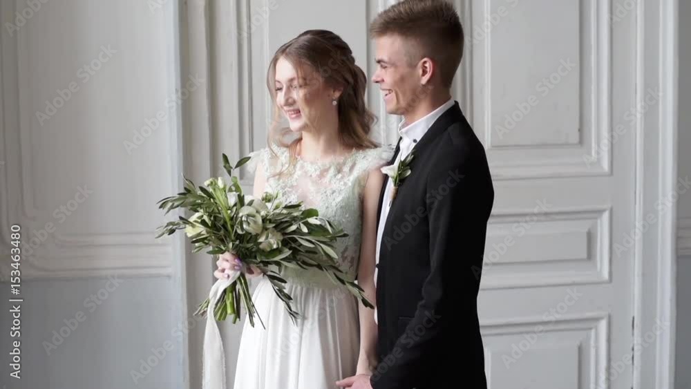 Wedding couple indoors is hugging each other Wedding couple indoors is hugging each other