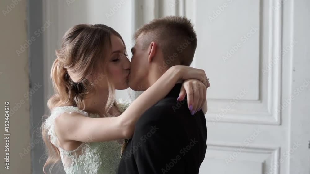 Wedding couple indoors is hugging each other Wedding couple indoors is hugging each other