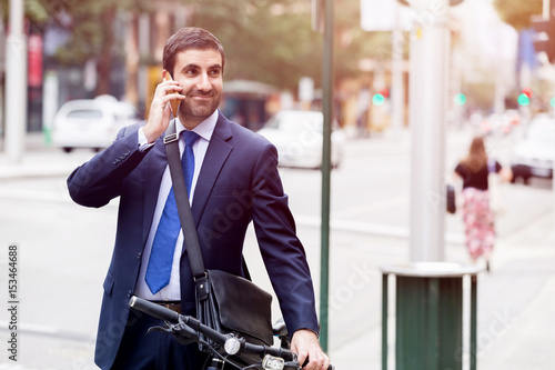 Young businessmen with a bike