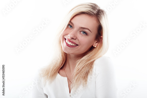 Beautiful woman smiling face close up studio on white.