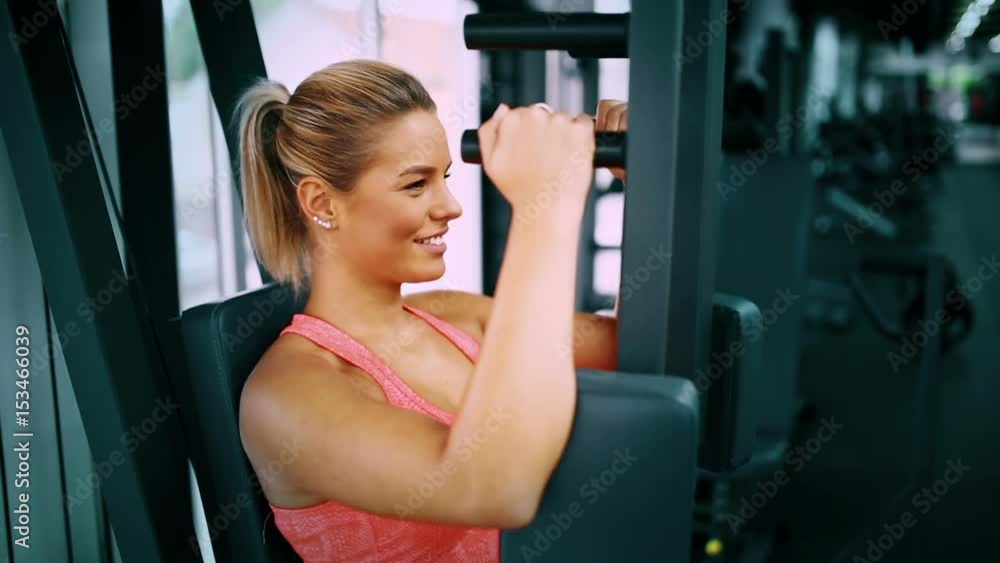 Beautiful woman doing chest exercises Beautiful woman doing chest exercises