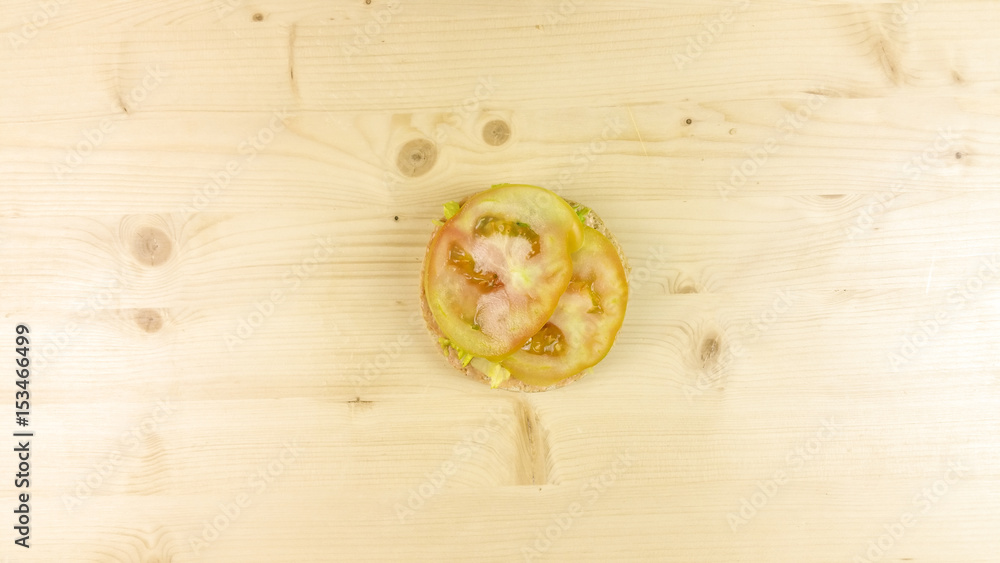 Making burger and chips on wooden background - top view Making burger and chips on wooden background - top view