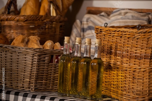 Sesame oil and bread in wicker basket