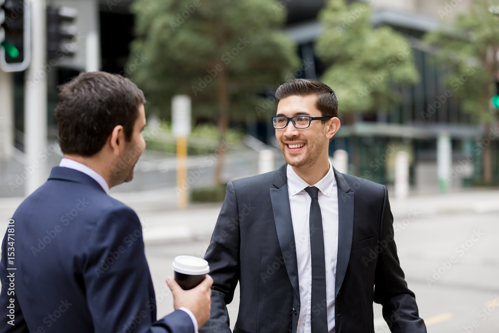 Two businessmen talking outdoors Two businessmen talking outdoors