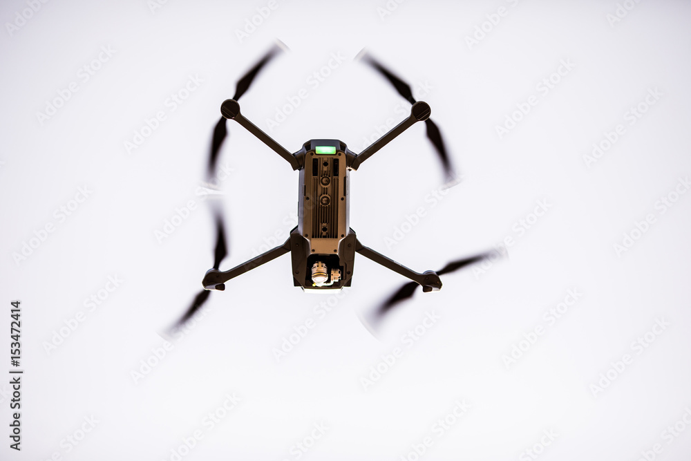 Quadrocopters with camera during flight in the sky