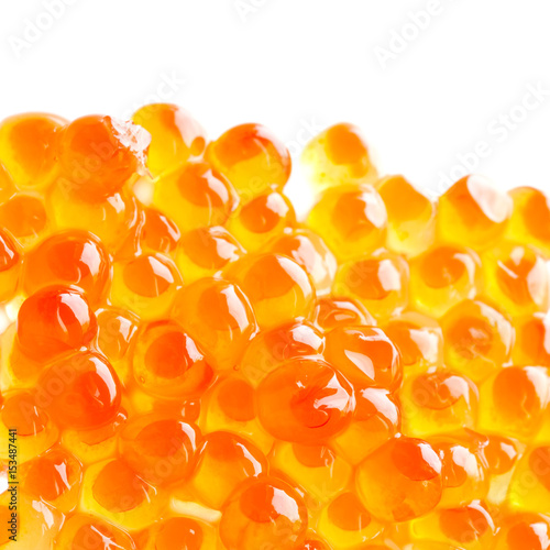 Salmon fish red caviar isolated on white background. Tradition delicatessen healthy food macro view. Shallow depth of field, selective focus.
