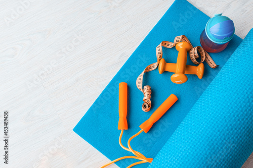 Wallpaper Mural Fitness concept - yoga mat, dumbbells, skipping rope, water bottle and tape measure Torontodigital.ca