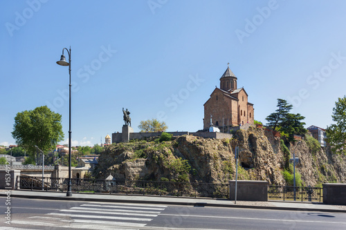 Metekhi Church of the Dormition of the virgin. Monument to Vakhtang I Gorgasali. Famous landmark in Tbilisi, Georgia. photo