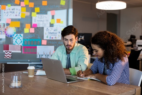 Creative business people working on desk © WavebreakMediaMicro