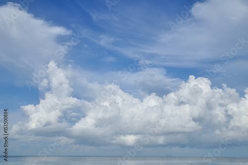 Blue sky with white clouds at the sea.