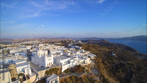 Flight over the village of Plaka on the Island of Milos, Cyclades, Greece.