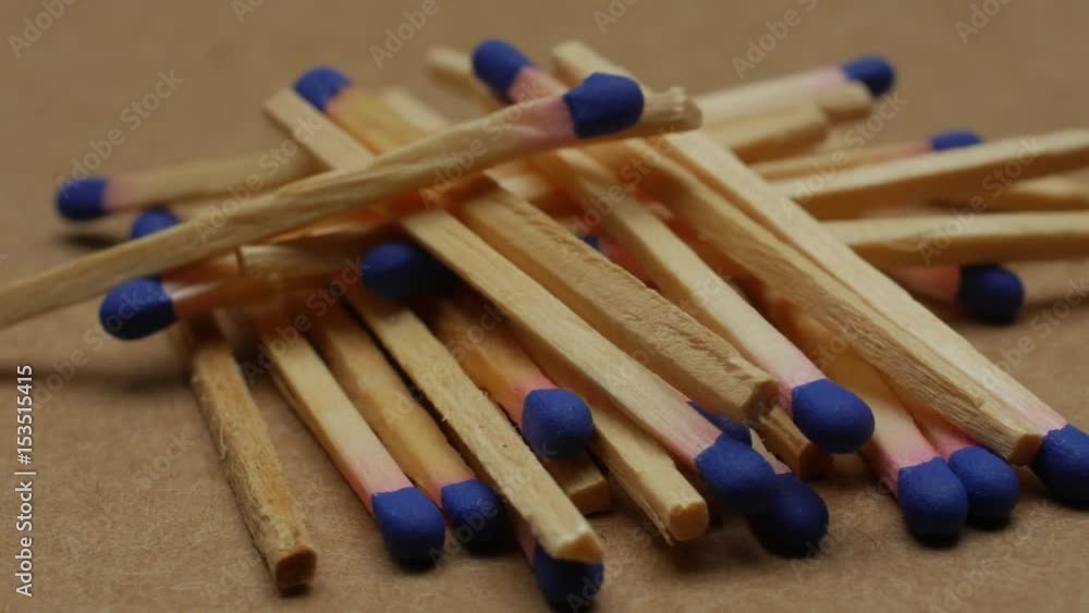 Scattered matches on rotating table, close up video. Scattered matches on rotating table, close up video.