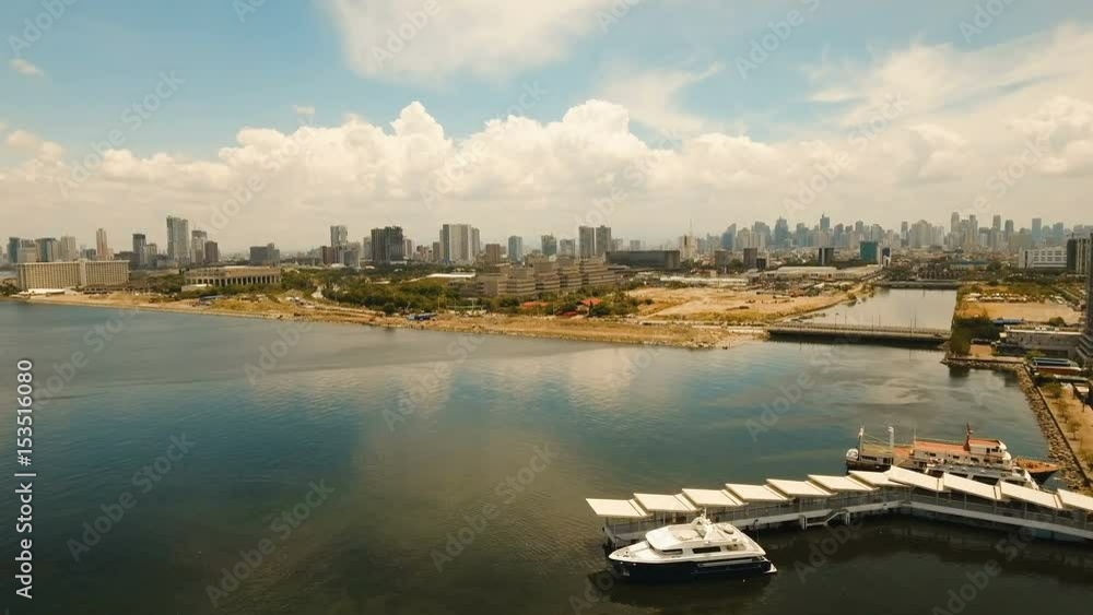 Aerial view of Manila city. Fly over city with skyscrapers and buildings. Aerial skyline of Manila . Modern city by sea, highway, cars, skyscrapers, shopping malls. Aerial footage Makati district. 4K Aerial view of Manila city. Fly over city with skyscrapers and buildings. Aerial skyline of Manila . Modern city by sea, highway, cars, skyscrapers, shopping malls. Aerial footage Makati district. 4K
