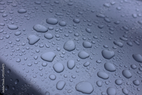 Water drops on top of metal surface © Maxim