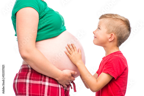 Kid with pregnant mother. isolated on white background