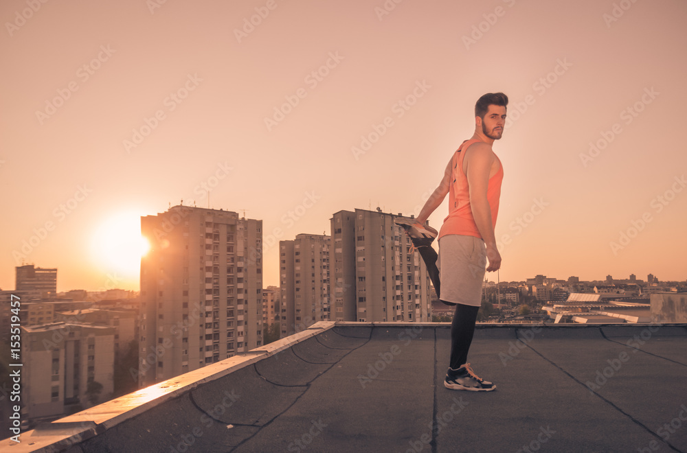 athlete man stretching rooftop roof, Sun sunset sunrise