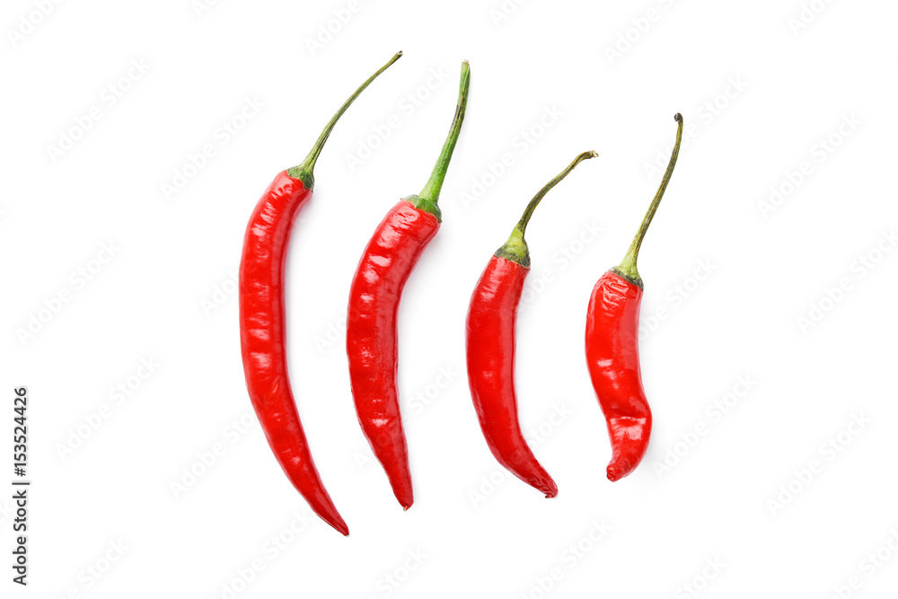 line of hot chili peppers on white background