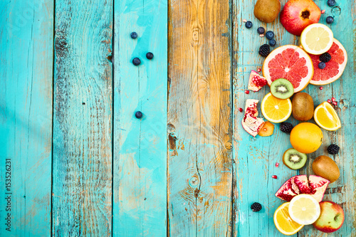 Colorful fruit on wood background