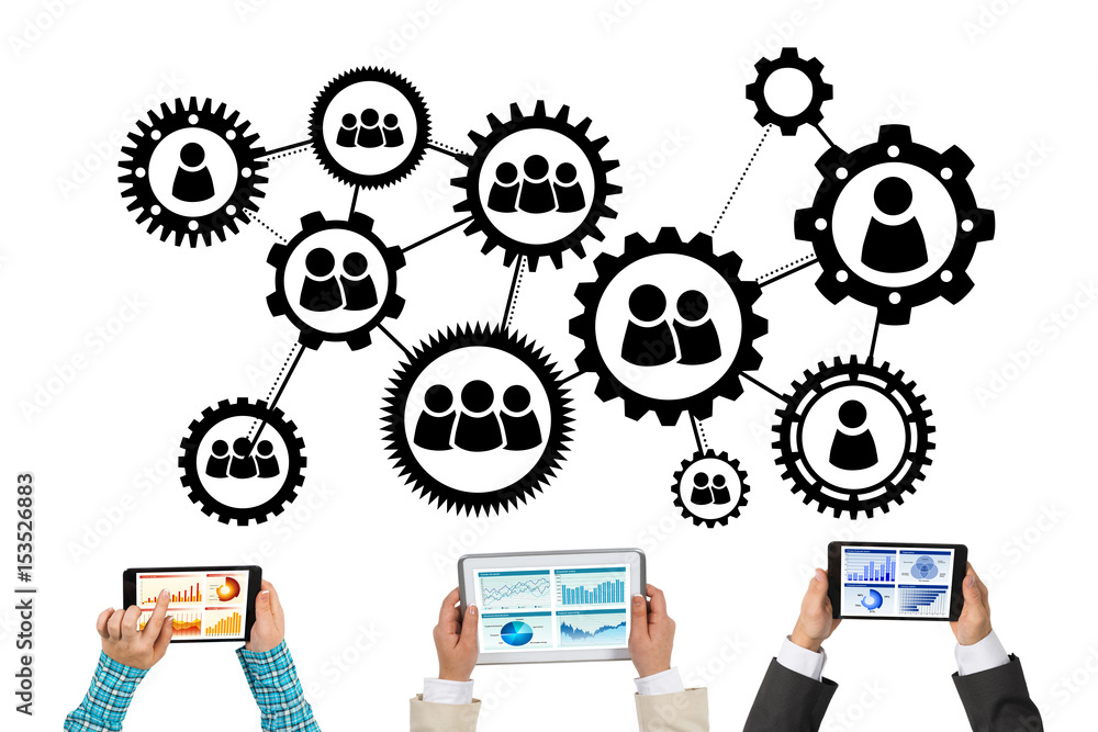 Top view of businesspeople sitting at table and using gadgets Top view of businesspeople sitting at table and using gadgets