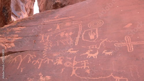 Example of petroglyphs rock carvings made by pecking directly on the rock surface using a stone chisel and a hammerstone.
 photo