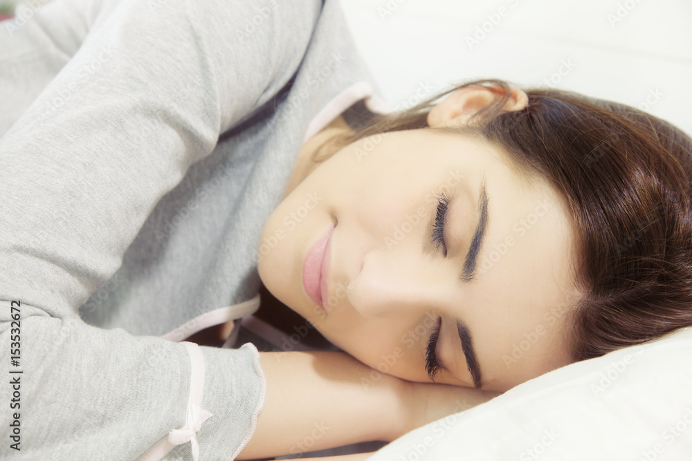 Beautiful woman sleeping in dream atmosphere in bed Beautiful woman sleeping in dream atmosphere in bed